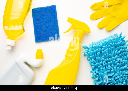 Detergent bottles and blue sponges isolated on white background. Stock Photo