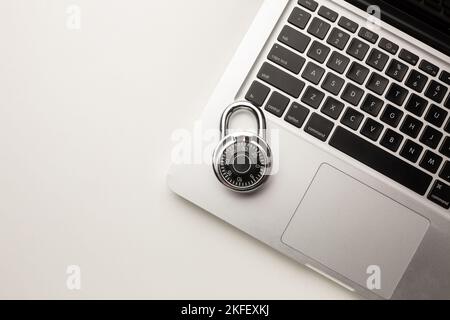 Code-locked padlock on the laptop computer. internet security and Computer security Concept. Stock Photo