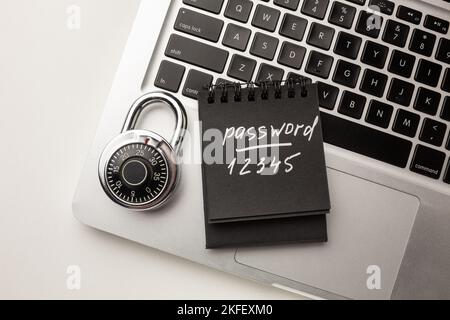 Code-locked padlock on the laptop computer. internet security and Computer security Concept. Stock Photo