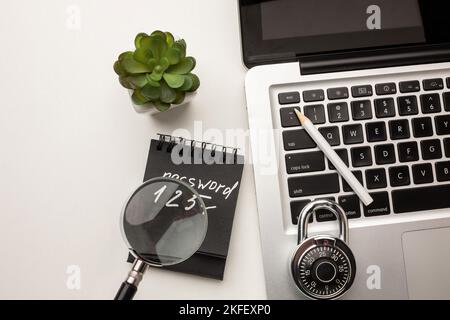 Strong steel coded lock on a laptop keyboard. IT security policies, passwords codes management, account and network security. Top view. Stock Photo