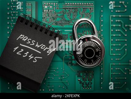 Strong steel coded lock on circuit board. IT security policies, passwords codes management, account and network security. Top view. Stock Photo