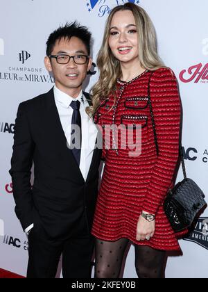 BEVERLY HILLS, LOS ANGELES, CALIFORNIA, USA - NOVEMBER 17: Australian director James Wan and partner/Romanian actress Ingrid Bisu arrive at the 36th Annual American Cinematheque Awards Honoring Ryan Reynolds held at The Beverly Hilton Hotel on November 17, 2022 in Beverly Hills, Los Angeles, California, United States. (Photo by Xavier Collin/Image Press Agency) Stock Photo