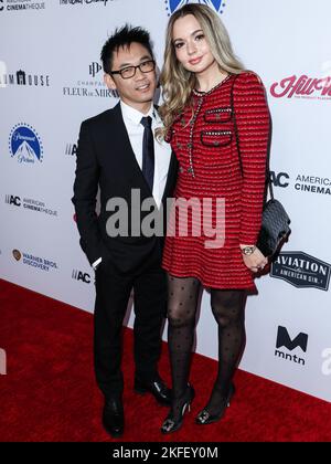 BEVERLY HILLS, LOS ANGELES, CALIFORNIA, USA - NOVEMBER 17: Australian director James Wan and partner/Romanian actress Ingrid Bisu arrive at the 36th Annual American Cinematheque Awards Honoring Ryan Reynolds held at The Beverly Hilton Hotel on November 17, 2022 in Beverly Hills, Los Angeles, California, United States. (Photo by Xavier Collin/Image Press Agency) Stock Photo