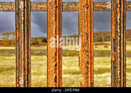 Old weathered textured rusty metal railings Stock Photo
