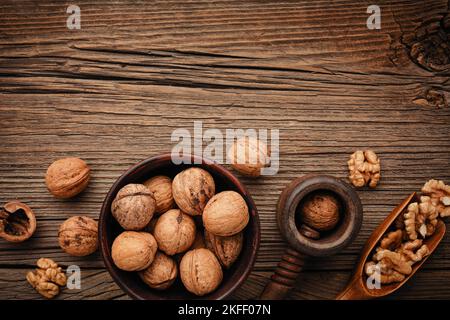 Various nuts on a wooden table. Top view with copy space Stock Photo