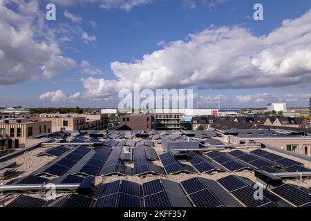 Solar panels on new NOM apartment complex rooftop in Noorderhaven neighbourhood seen from above. Aerial real estate modern energy neutral architecture Stock Photo