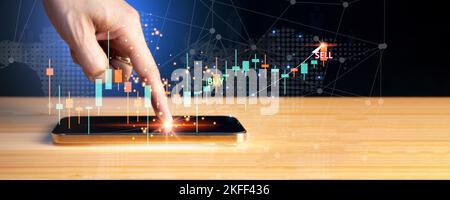 Businessman working with smartphone and virtual graphs, closeup. Financial trading concept Stock Photo