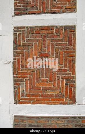 Close up of half-timbered brick with white beams as background Stock Photo