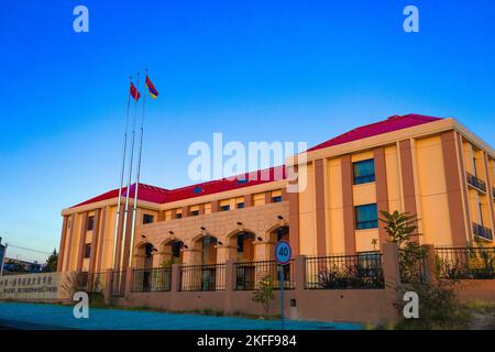 Yerevan, Armenia - October 27, 2022: Armenian-Chinese friendship school building at sunset, with warm colored walls during the magic hour, golden hour Stock Photo