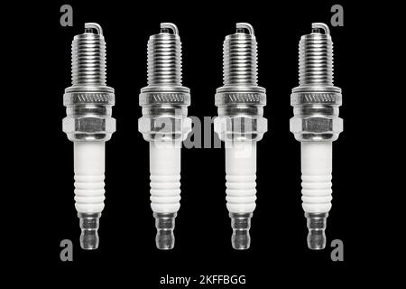Macro shot of spark plug isolated on black background. A spark plug for an engine isolated with clipping path. Quality spare parts for car service or Stock Photo