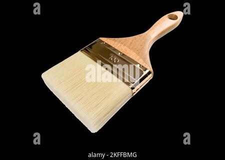 Clean new paint brush isolated on black background. Red handle paint brush isolated on black background Stock Photo
