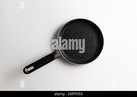 New pan isolated on white background. Empty pan with nonstick coating . Teflon pan Stock Photo