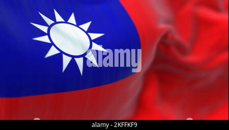 Close-up view of the Taiwan national flag waving. The Republic of China is a state located in East Asia. Fabric textured background. Selective focus. Stock Photo