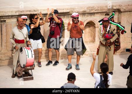 Jerash, Jordan - November 7, 2022: Jordanian bagpipe players in the roman theatre of the archeological site Stock Photo