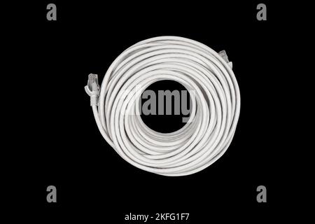 Internet data cable isolated on black background. LAN cable patch cord. Network internet cable isolated over black. Ethernet cable. Network cable Stock Photo