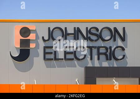 Nis, Serbia - August 04, 2022: Johnson Electric Factory Car Parts Manufacturer Logo Sign. Stock Photo