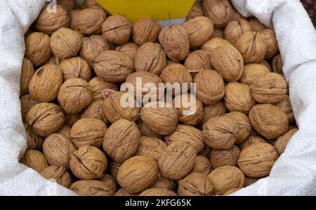 close up shelled walnut pile. pile of shelled walnuts in the sack. Stock Photo