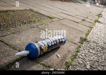 A Fast Gas nitrous oxide cylinder lies on the pavement of a surburban south London street, on 17th November 2022, in London, England. Fast Gas state that their nitrous oxide disposable cylinders have a capacity of 640 grams of nitrous oxide with a purity level of 99%. Nitrous oxide is illegal under the 2016 Psychoactive Substances Act but laughing gas is now the fourth most used drug in the UK, according to the Global Drug Survey 2015. (Photo by Richard Baker / In Pictures via Getty Images)