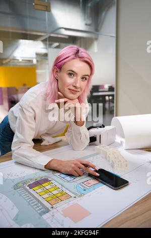 Architect working in coworking, making notes on the project Stock Photo