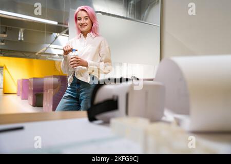 Portrait of female in the office during lunch break Stock Photo
