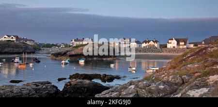 Porth Diana with houses of Trearddur Bay in late evening light on the western coast of Holy Island part of the Isle of Anglesey (Sir Ynys Mon) North W Stock Photo
