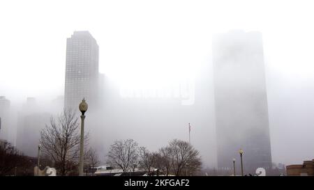 CHICAGO, ILLINOIS, UNITED STATES - DEC 12, 2015: Downtown Chicago skyscrapers in the fog on an overcast winter day Stock Photo