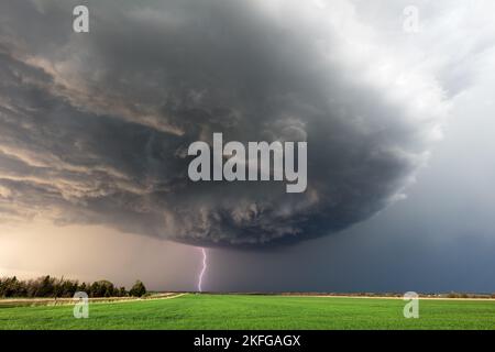 Dramatic storm clouds and lightning from a supercell thunderstorm near Herington, Kansas Stock Photo
