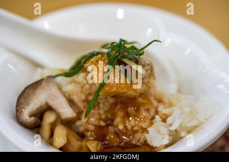 A bowl of delicious steamed fish slices with rice Stock Photo