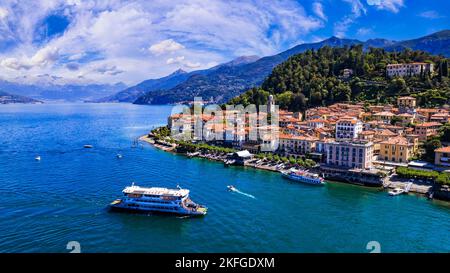 One of the most beautiful lakes of Italy - Lago di Como. aerial panoramic view of beautiful Bellagio village and ferryboat.  popular tourist destinati Stock Photo