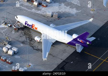 Fedex McDonnell Douglas MD-11 airplane. Aircraft for cargo transport for Federal Express. Aerial view of MD11 plane. Stock Photo