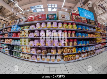 Cuneo, Italy - November 18, 2022: shelves with packs of panettone and pandoro Christmas cakes in Conad supermarket, is a brand of Italian large-scale Stock Photo