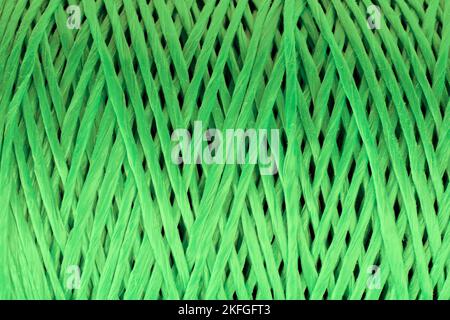 Coiled nylon rope texture background. Green rolled  striped nylon rope pattern. A coil of new colored rope surface Stock Photo