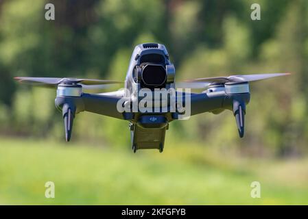 LENINGRAD REGION, RUSSIA - MAY 30, 2021: Flying DJI FPV Drone close-up. Front view Stock Photo