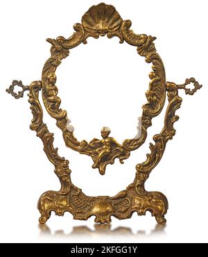 Close-up of an empty old metal vintage picture frame with pedestal (gold colored) isolated on white background. Stock Photo