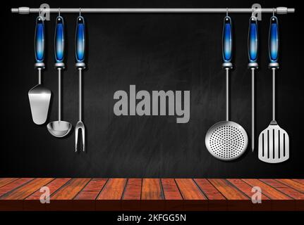 Empty wooden kitchen counter (wooden table for products display) with a set of kitchen utensils and a blackboard with copy space on background. Stock Photo