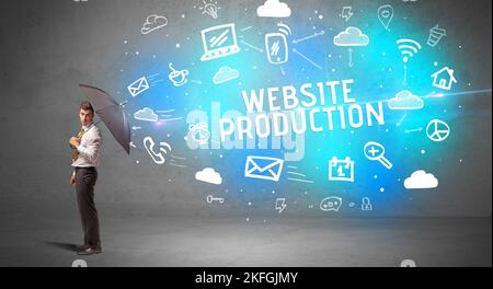 Businessman defending with umbrella, modern technology concept Stock Photo