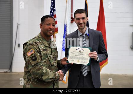 Brig. Gen. Daryl O Hood (left), the commanding general of the 20th Chemical, Biological, Radiological, Nuclear, Explosives (CBRNE) Command, awards the Civilian Service Achievement Medal to Adam M. Ochylski, Sept. 16.  Ochylski from the 20th CBRNE Command Logistics Section was the Civilian of the Quarter for the 4th quarter.  U.S. Army photo by Angel D. Martinez-Navedo. Stock Photo