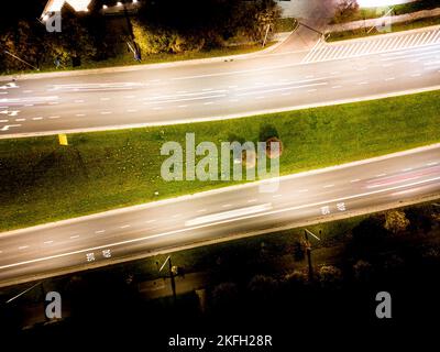 Night  traffic transportation at the roundabout street road, City and connection technology, futuristic abstract background for financial technology a Stock Photo