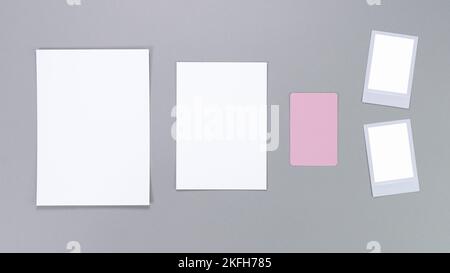 Template composition with blank photo cards, instant cards, polaroid frame and isolated on grey background for easy editing. Mockup, photo card Stock Photo