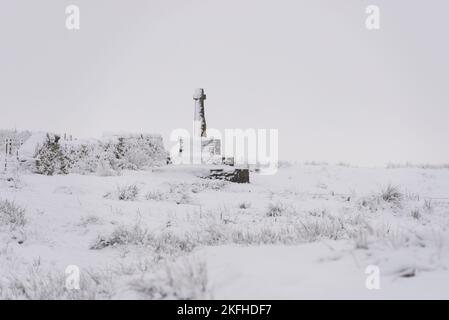 Compstons Cross covered in snow on a cold winter morning. Loveclough, Rossendale moorland historic landmark Stock Photo