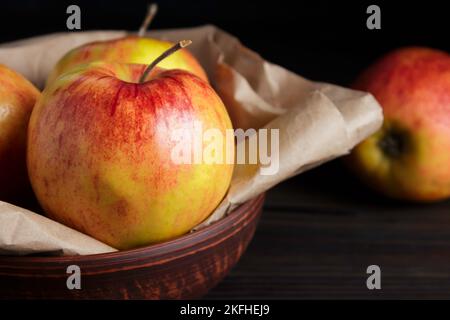 Fresh Gala apples on dark background. Red-yellow apples. Rustic style Stock Photo