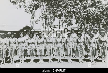 Members of an African American company of the Women's Army Auxiliary Corps lined up for review, Liberia, 1939 - 1945. Stock Photo