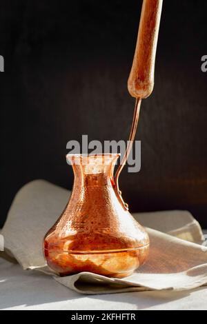 Turkish copper Cezve for coffee brewing. Stock Photo