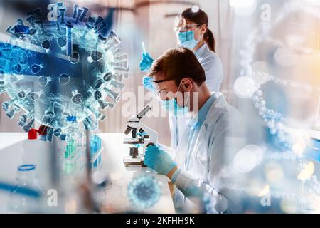 Doctor in the laboratory analyzes samples of codiv-9 under a microscope Stock Photo