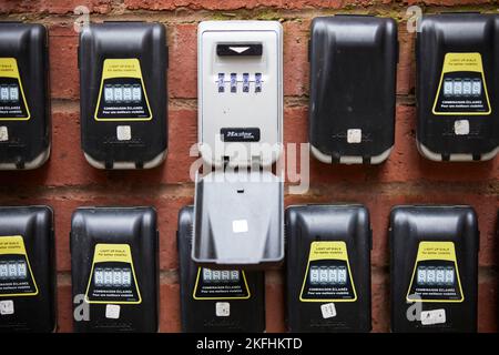 Collection of Master Lock water resistant combination safes on a apartment wall Stock Photo