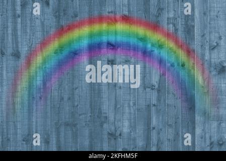Wooden fence panel background. Blue rustic textured and abstract backdrop with rainbow. One Love Stock Photo