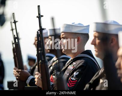 220917-N-PL946-1318 ATLANTIC OCEAN (Sept. 17, 2022) Members of the rifle detail present arms during a burial at sea ceremony aboard the first-in-class aircraft carrier USS Gerald R. Ford (CVN 78).  During the ceremony, the cremated remains of 30 souls were committed to the sea in the Atlantic Ocean. Ford is underway in the Atlantic Ocean conducting carrier qualifications and workups for a scheduled deployment this fall. Stock Photo