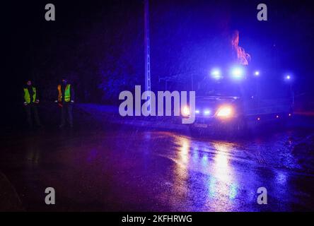 Police are seen guarding a road to a farm where a missile strike killed two men in Przewodow, Poland on 16 November, 2022. On Tuesday a missile struk Stock Photo