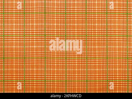 Checkered fabric in brown. Background from checkered fabric. Material with straight lines and squares Stock Photo