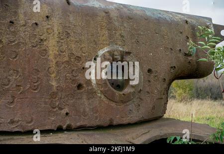 rust covered carcass of an abandoned wrecked rusting British Centurion main battle tank in afternoon sunlight Stock Photo